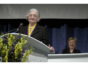 FILE - In this Oct. 8, 2005 file photo, Betty Bumpers speaks after being inducted into the National Women's Hall of Fame in Seneca Falls, N.Y. Fellow-inductee Hillary Clinton is pictured to the right. Bumpers, the wife of former Arkansas governor and four-term U.S. Sen. Dale Bumpers has died at her home in Little Rock. The daughter of Bumpers, Brooke Bumpers, said her mother died Friday, Nov. 23, 2018, of complications from a recent fall and dementia. She was 93.