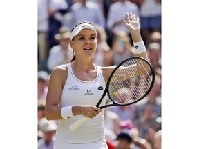 FILE -In this July 8, 2017, file photo, Poland's Agnieszka Radwanska celebrates after beating Switzerland's Timea Bacsinszky in their women's singles at the Wimbledon Tennis Championships in London. Radwanska says she is retiring from tennis after a 13-year career. The 29-year-old, who reached a career-high ranking of No. 2, says she is "no longer able to train and play the way I used to."