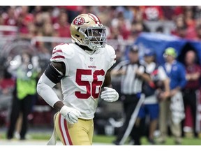 FILE - In this Oct. 28, 2018, file photo, San Francisco 49ers' Reuben Foster (56) jogs on the field during the first half of an NFL football game against the Arizona Cardinals in Glendale, Ariz. The Washington Redskins claimed Foster off waivers on Tuesday, Nov. 27, 2018, after the 49ers released the linebacker following a domestic violence arrest. The team says conversations with former Alabama teammates led to the decision to claim Foster.