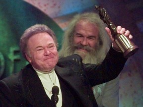 FILE- In this April 23, 1997, file photo, musician Roy Clark celebrates after receiving the Pioneer Award at the Academy of Country Music Awards in Universal City, Calif. Clark, the guitar virtuoso and singer who headlined the cornpone TV show "Hee Haw" for nearly a quarter century, died Thursday, Nov. 15, 2018, due to complications from pneumonia at home in Tulsa, Okla., publicist Jeremy Westby said. He was 85.