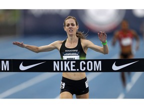 FILE- In this June 21, 2018, file photo, Molly Huddle crosses the finish line as she win the women's 10,000-meter run at the U.S. Championships athletics meet in Des Moines, Iowa. Shalane Flanagan last year became the first American woman in 40 years to win the NYC Marathon. Desiree Linden followed with a victory in Boston. All of which motivates Huddle for Sunday's race in New York, who was third there in 2016 in her marathon debut.