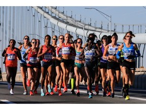 Elite women runners cross the Verrazano-Narrows Bridge during the New York City Marathon on Sunday, Nov. 4, 2018, in New York.