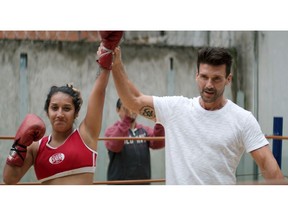 This image released by Netflix shows actor and self-described fight enthusiast, Frank Grillo, right, in a scene from "FightWorld," a docu-series that follows Grillo as he goes globe-trotting to explore fighting styles and the cultures behind them. (Netflix via AP)