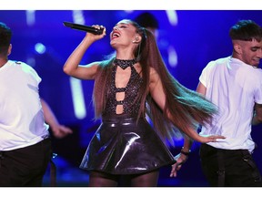 FILE - In this June 2, 2018 file photo, Ariana Grande performs at Wango Tango in Los Angeles. Billboard named the 25-year-old award-winning singer its 2018 Woman of the Year. Grande will receive the award at Billboard's 13th annual Women in Music event on Dec. 6 in New York.