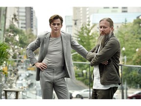 In this Sept. 7, 2018 photo, David Mackenzie, right, director of the film "Outlaw King," and actor Chris Pine pose during the Toronto Film Festival at the Shangri-La Hotel in Toronto.