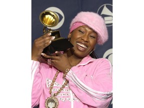FILE - In this Feb. 23, 2003 file photo, Missy Elliott holds the Grammy for best female rap solo performance for the song "Scream a.k.a. Itchin'" at the 45th Annual Grammy Awards in New York. Elliott, one of rap's greatest voices and also a songwriter and producer who has crafted songs for Beyonce and Whitney Houston, is one of the nominees for the 2019 Songwriters Hall of Fame.