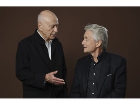 In this Nov. 7, 2018 photo, Alan Arkin, left, and Michael Douglas, cast members in the Netflix comedy series "The Kominsky Method," appear at the Beverly Wilshire Four Seasons hotel in Beverly Hills, Calif. The pair play Hollywood veterans facing the indignities of aging in a change-of-pace comedy-drama from sitcom hitmaker Chuck Lorre.