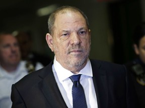FILE - In this Oct. 11, 2018 file photo, Harvey Weinstein enters State Supreme Court in New York. Actress Paz de la Huerta is suing Weinstein, saying the movie mogul raped her, harassed her and hurt her career. The lawsuit filed Tuesday, Nov. 13, in Los Angeles Superior Court alleges Weinstein raped de la Huerta twice in New York in December 2010. Police said last November they were investigating, but no charges have been filed.