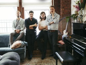 In this Sept. 28, 2018 photo, members of Mumford & Sons, from left, Ben Lovett, Marcus Mumford, Winston Marshall and Ted Dwane pose for a portrait in New York to promote their fourth album "Delta."