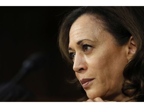 FILE- In this Sept. 6, 2018, file photo Sen. Kamala Harris, D-Calif., listens as President Donald Trump's Supreme Court nominee, Brett Kavanaugh, answers her question during the third day of Kavanaugh's Senate Judiciary Committee confirmation hearing on Capitol Hill in Washington. Harris, whose memoir comes out Jan. 8, isn't only writing for those of voting age. The picture book memoir "Superheroes Are Everywhere" will be released around the same time, Penguin Young Readers announced Monday, Nov. 19.