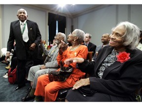 FILE- In this May 10, 2005, file photo survivor of the 1921 Tulsa race riots, Otis Granville Clark, 102, left, acknowledges the introduction, as fellow survivors, Dr. Olivia Hooker, 90, right, and Wess Young, 88, second left, and his wife, Cathryn Young, second right, give their applause at the start of a briefing before members of the Congressional Black Caucus and other leaders on Capitol Hill in Washington. Hooker, one of the last survivors of the race riot, one of the worst race riots in U.S. history, has died at age 103.