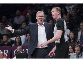 Houston Rockets head coach Mike D'Antoni, left, argues with referee Ed Malloy during the first half of an NBA basketball game against the Brooklyn Nets, Friday, Nov. 2, 2018, in New York.