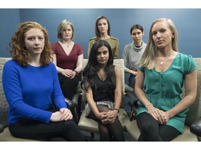 In this Wednesday, Nov. 14, 2018 photo from left back row, Annemarie Brown, Andrea Courtney, and Marissa Evansin, and from left front row, Sasha Brietzke, Vassiki Chauhan, Kristina Rapuano, pose in New York. The women filed a lawsuit against Dartmouth College for allegedly allowing three professors to create a culture in their department that encouraged drunken parties and subjected female graduate students to harassment, groping and sexual assault.