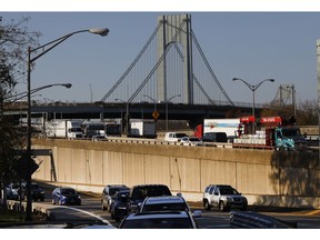 Traffic moves over the Verrazzano-Narrows Bridge, Wednesday morning, Nov. 21, 2018, in the Brooklyn borough of New York. The AAA auto club predicts that 54.3 million Americans will travel at least 50 miles from home between Wednesday and Sunday during the Thanksgiving holiday weekend.