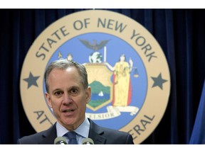FILE - In this Feb. 11, 2016, file photo, New York Attorney General Eric T. Schneiderman speaks during a news conference in New York. The prosecutor appointed to investigate allegations that former New York Attorney General Schneiderman physically abused women says she has closed the case without bringing criminal charges, Thursday, Nov. 8, 2018. Schneiderman said in a statement he didn't consider the decision an exoneration. He also apologized "for any and all pain that I have caused."
