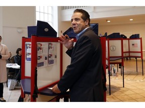 New York Gov. Andrew Cuomo pauses as he marks his ballot at the Presbyterian Church of Mount Kisco, in Mt. Kisco, N.Y. Tuesday, Nov. 6, 2018.
