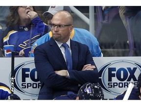 FILE - In this Thursday, Oct. 25, 2018, file photo, St. Louis Blues head coach Mike Yeo watches from the bench during the second period of an NHL hockey game against the Columbus Blue Jackets, in St. Louis. Early Tuesday, Nov. 20, 2018, Blues general manager Doug Armstrong announced that the team has fired Yeo and named Craig Berube as his interim replacement.