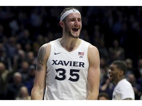 Xavier forward Zach Hankins (35) reacts after a turnover during the first half of an NCAA college basketball game against Wisconsin, Tuesday, Nov. 13, 2018 in Cincinnati.