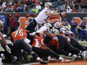 New Orleans Saints quarterback Drew Brees (9) dives in for a touchdown in the second half of an NFL football game, Sunday, Nov. 11, 2018, in Cincinnati.