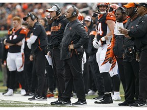 Cincinnati Bengals special assistant Hue Jackson, center, stands on the sideline in the first half of an NFL football game against the Cleveland Browns, Sunday, Nov. 25, 2018, in Cincinnati.