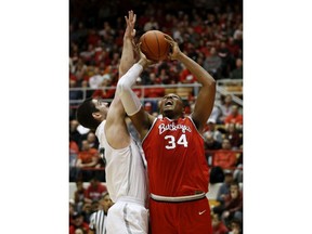 Ohio State forward Kaleb Wesson, right, goes up to shoot against Cleveland State sophomore Stefan Kenic during the first half of an NCAA college basketball game in Columbus, Ohio, Friday, Nov. 23, 2018.