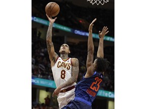 Cleveland Cavaliers' Jordan Clarkson (8) shoots over Oklahoma City Thunder's Terrance Ferguson (23) during the first half of an NBA basketball game Wednesday, Nov. 7, 2018, in Cleveland.
