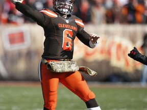 Cleveland Browns quarterback Baker Mayfield throws a 28-yard touchdown pass to wide receiver Rashard Higgins in the first half of an NFL football game against the Atlanta Falcons, Sunday, Nov. 11, 2018, in Cleveland.