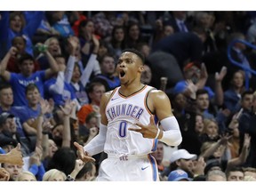 Oklahoma City Thunder guard Russell Westbrook (0) reacts after scoring against the Charlotte Hornets during the first half of an NBA basketball game in Oklahoma City, Friday, Nov. 23, 2018.