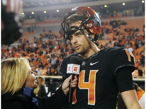 Oklahoma State quarterback Taylor Cornelius speaks with a reporter following an NCAA college football game in Stillwater, Okla., Saturday, Nov. 17, 2018. Oklahoma State defeated West Virginia 45-41.