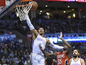 Oklahoma City Thunder guard Russell Westbrook (0) puts up a shot over New Orleans Pelicans forward E'Twaun Moore (55) in the second half of an NBA basketball game in Oklahoma City, Monday, Nov. 5, 2018.