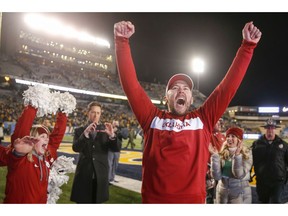 Oklahoma coach Lincoln Riley yells after the team's 59-56 win over West Virginia during an NCAA college football game in Morgantown, W.Va., Friday, Nov. 23, 2018. Oklahoma earned a spot in the Big 12 championship game.