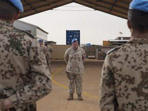 Commanding Officer of the Aviation Battalion, Lieutenant-Colonel Chris Morrison stands at ease during a parade to mark Canada's achievement of our initial operating capability to deliver Forward Aeromedical Evacuations for MINUSMA from Camp Castor in Gao, Mali on July 31, 2018.