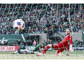Portland Timbers' Sebastian Blanco, center, fires a shot into the back of the Seattle Sounders' net for a first-half goal during an MLS soccer game in the Western Conference semifinals in Portland, Ore., Sunday, Nov. 4, 2018.