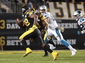 Pittsburgh Steelers inside linebacker Vince Williams (98) returns an interception for a touchdown during the first half of the team's NFL football game against the Carolina Panthers in Pittsburgh, Thursday, Nov. 8, 2018.