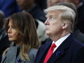 President Donald Trump and his first lady Melania Trump attend ceremonies at the Arc de Triomphe Sunday, Nov. 11, 2018 in Paris. Over 60 heads of state and government were taking part in a solemn ceremony at the Tomb of the Unknown Soldier, the mute and powerful symbol of sacrifice to the millions who died from 1914-18.