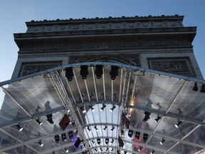 A stand is set up in front the Arc de Triomphe ahead of ceremonies marking the 100th of the end of World War I, Friday, Nov.9, 2018. About 60 leaders will mark Sunday the cease-fire that came on the 11th hour of the 11th day of the 11th month of 1918.