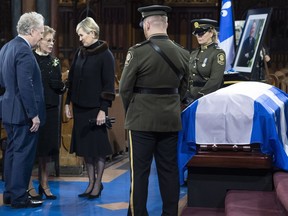 Former Quebec premier Jean Charest and his wife Michele Dionne offer their condolences to Chantal Renaud, wife of former Quebec premier Bernard Landry who died last week, during a public viewing in Montreal on Monday, November 12, 2018.