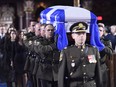 The casket of former Quebec premier Bernard Landry is carried into Notre-Dame Basilica for his funeral service in Montreal on Tuesday, November 13, 2018.
