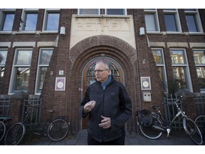 Theo Hettema, chair of the General Council of the Protestant Church of The Hague, answers questions during an interview in front of the Bethel church in The Hague, Netherlands, Friday, Nov. 30, 2018. For more than a month, a rotating roster of preachers and visitors has been leading a non-stop, round-the-clock service at a small Protestant chapel in a quiet residential street in The Hague in an attempt to prevent the deportation of a family of Armenian asylum seekers.