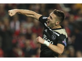 Ajax's Dusan Tadic celebrates scoring 1-1 during the Champions League group E soccer match between Benfica and Ajax at the Luz stadium in Lisbon, Wednesday, Nov. 7, 2018.