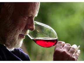 FILE--In this Feb. 23, 2004, file photo, winemaker David Lett savors the bouquet from a glass of Pinot Noir at his Eyrie Vinyards home in Dundee, Ore. Officials in Oregon and at a U.S. government agency are similarly finicky, and have told a California winery to back off its claims it makes an Oregon pinot noir.