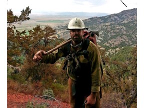 This 2014 photo provided by Christopher Schott shows him during his first year on a firefighting crew out of Lakeview, Ore. Schott served two tours in Afghanistan with the Army's 7th Special Forces Group and said joining the Oregon-based crew helped get his life back on track.   (Christopher Schott via AP)