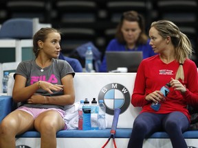 US Danielle Rose Collins, right, talks to her teammate Sofia Kenin, left, during a training session prior to the final match of the Fed Cup between Czech Republic and USA in Prague, Czech Republic, Wednesday, Nov. 7, 2018.