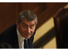 Czech Republic's Prime Minister Andrej Babis addresses lawmakers during a parliament session in Prague, Czech Republic, Friday, Nov. 23, 2018. The Czech coalition government is facing a parliamentary no-confidence vote over Prime Minister Andrej Babis' fraud scandal. Babis faces charges that he has misused EU subsidies for a farm he transferred to his family members, including his son, Andrej Babis, Jr. Babis denies wrongdoing.