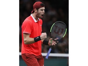 Karen Khachanov of Russia celebrates after winning a point against Novak Djokovic of Serbia during their final match of the Paris Masters tennis tournament at the Bercy Arena in Paris, France, Sunday, Nov. 4, 2018.