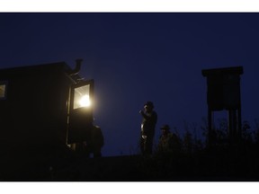 In this picture taken on Thursday, Nov. 15, 2018, fishermen prepare for the traditional fish haul of the Krcin pond near the village of Mazelov, Czech Republic. Czechs will have to pay more for their traditional Christmas delicacy this year after a serious drought devastated the carp population this year.