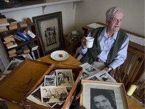 Harry Leslie Smith, sits with photographs of himself and his wife, Friede, in February 2016, whom he met during the Second World War.