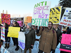 Pro-choice counterprotesters block graphic displays put up by UAlberta Pro-Life at a rally on March 3, 2015.