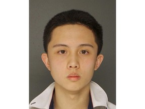 FILE – This undated photo provided by the Upper Darby Police Department in Upper Darby, Pa., shows An-Tso Sun who was accused of threatening to "shoot up" his high school near Philadelphia. Sun has been spared additional time in prison but will be deported.