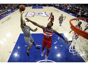 Philadelphia 76ers' Wilson Chandler (22) goes up to shoot against Washington Wizards' Jeff Green (32) during the first half of an NBA basketball game, Friday, Nov. 30, 2018, in Philadelphia.